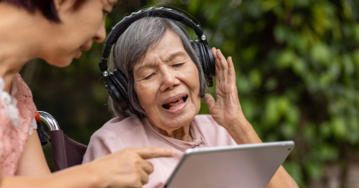 Elderly Asian Woman With Headphones
