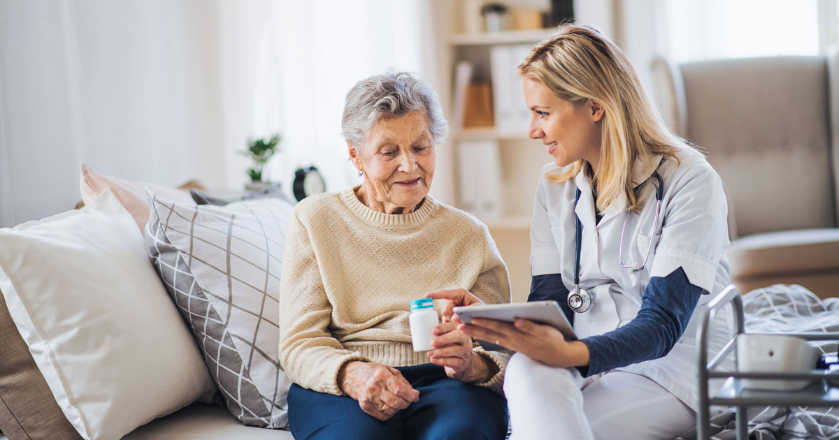 In-Home Healthcare Worker Explaining Medication