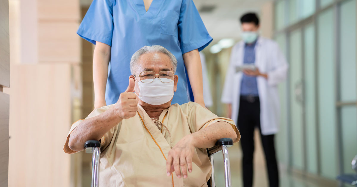 Asian Man in Face Mask & Wheelchair Giving Thumbs-up