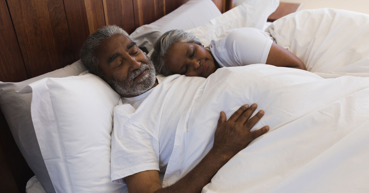 Black Elderly Couple Sleeping Together