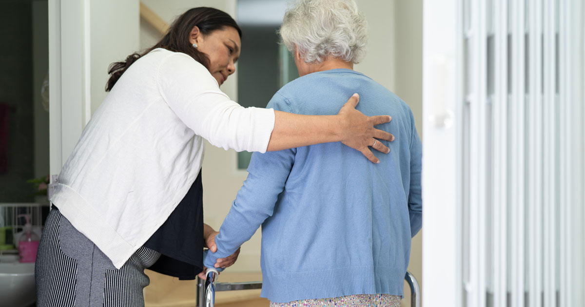 Caretaker Giving Walking Support