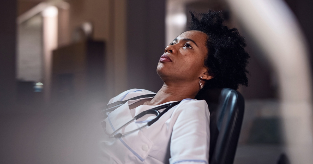 Tired Caregiver Sitting in Chair