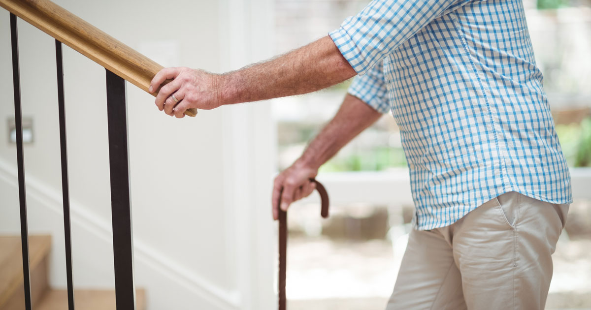 Elderly Man Climbing Stairs