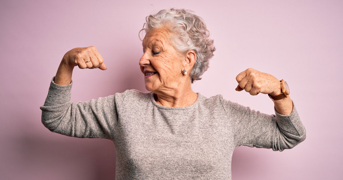 elderly woman flexing arms