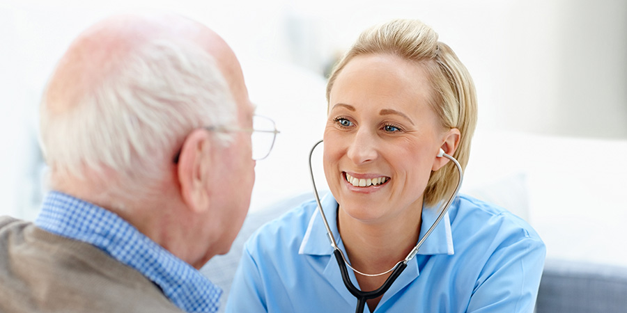 Doctor's Home Visit with Elderly Man