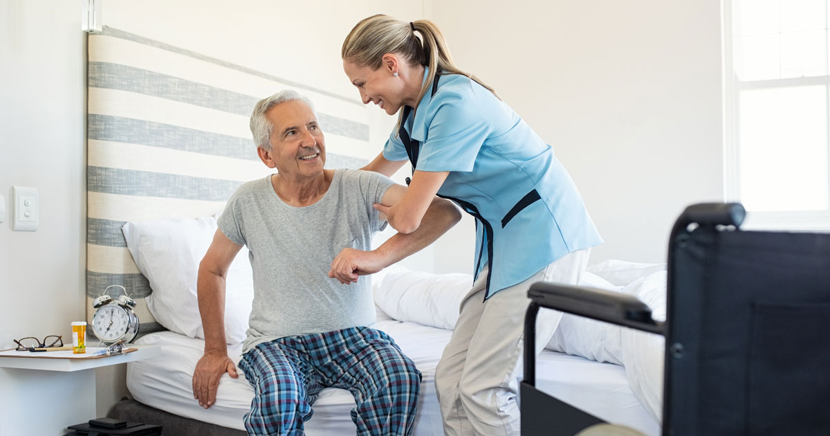 Nurse Helping Man Stand Up