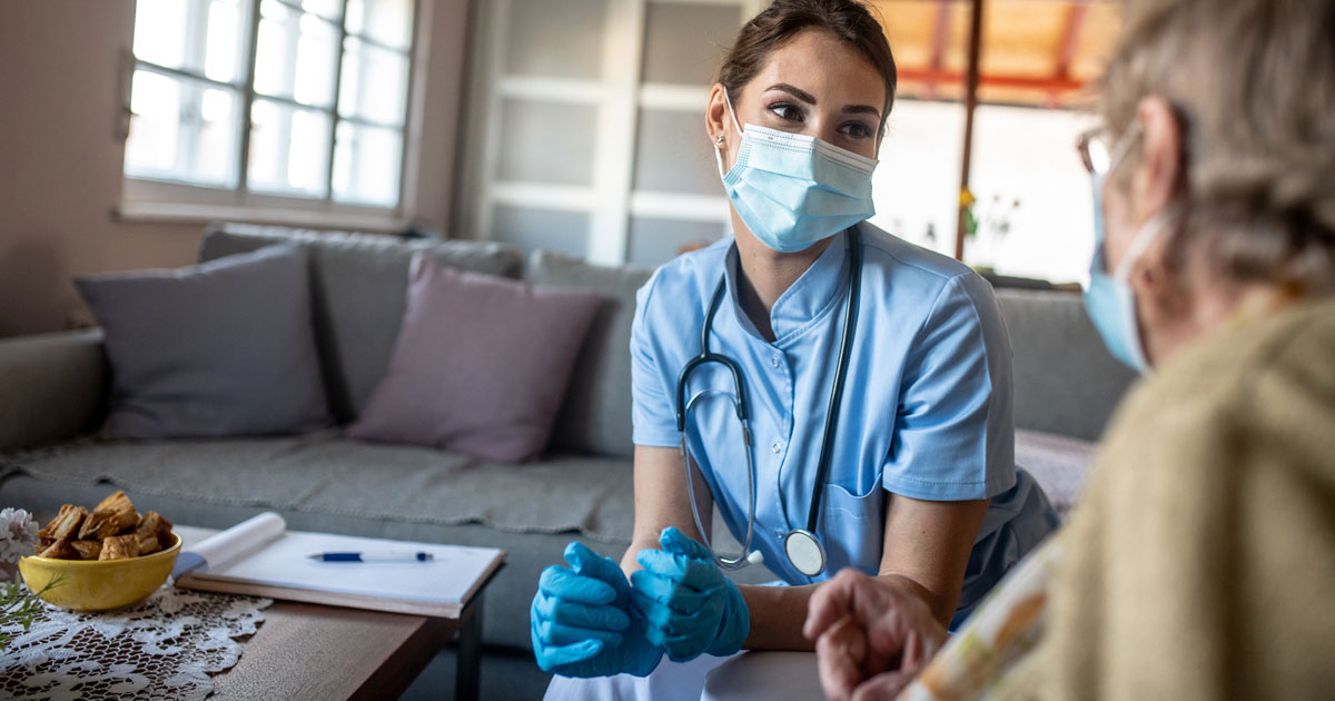 Nurse Helping Senior Woman