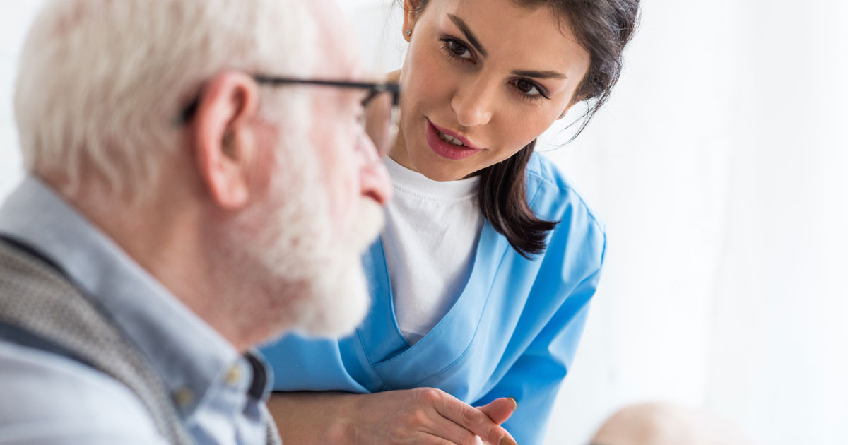 Nurse Talking With Elderly Man