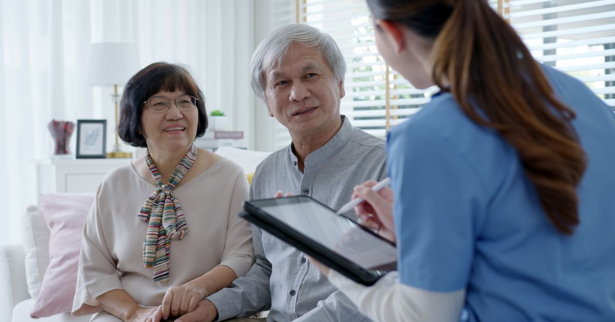 Asian Caregiver Assisting Patients