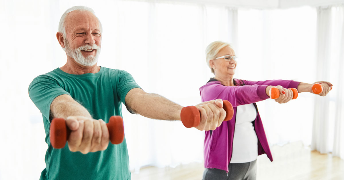 Senior Couple Lifting Dumbbells