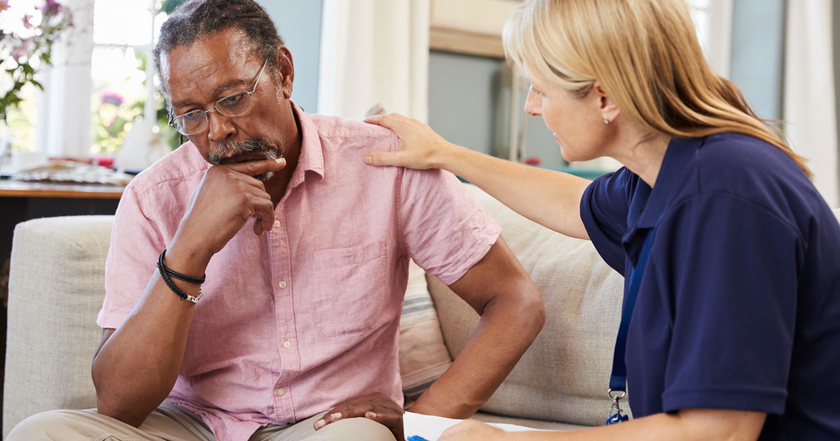 Support Worker Visiting Depressed Man