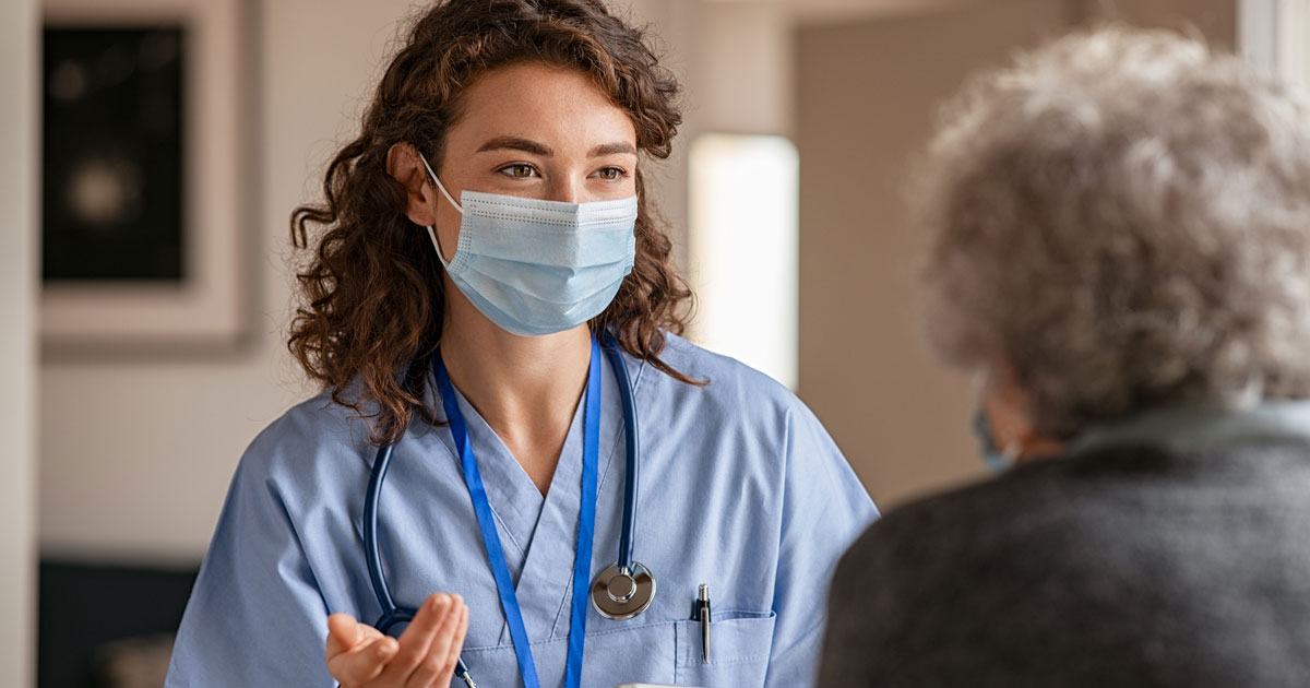 Young Female Doctor Visits Senior Woman