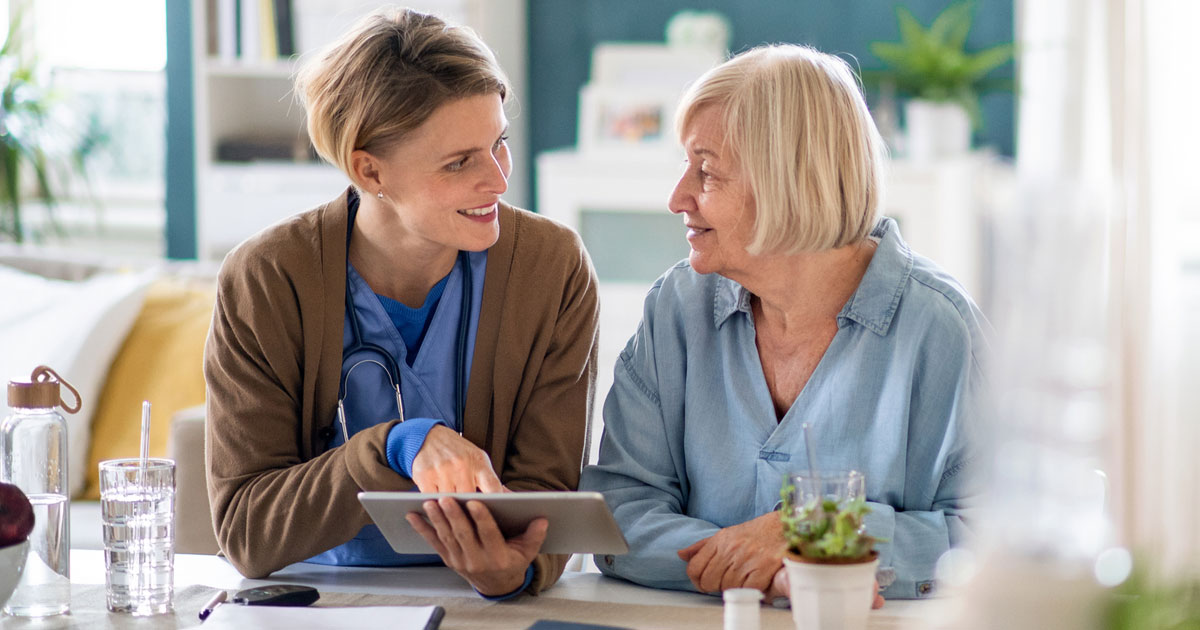 Caregiver With Senior Woman Patient